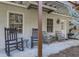 Inviting front porch with rocking chairs, creating a warm and welcoming entrance at 1009 Fairway Seven, Villa Rica, GA 30180