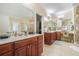 A spacious bathroom boasts double vanity, a tile shower, and a separate water closet at 6016 Southland Dr, Stone Mountain, GA 30087