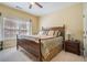 Bedroom featuring natural light, a large bed, and carpeted floors, creating a comfortable retreat at 6016 Southland Dr, Stone Mountain, GA 30087