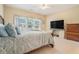 Bright bedroom featuring a large window and a comfortable bed, creating a tranquil space at 6016 Southland Dr, Stone Mountain, GA 30087