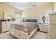 Bright bedroom with light walls, a large bed, and two dressers, creating a comfortable living space at 6016 Southland Dr, Stone Mountain, GA 30087