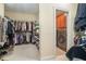 A large walk-in closet and laundry room with ample storage offer convenience and organization at 6016 Southland Dr, Stone Mountain, GA 30087