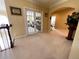 The upstairs landing is flooded with natural light and offers views to an office through french doors at 6016 Southland Dr, Stone Mountain, GA 30087