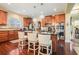 Modern kitchen with granite countertops, stainless steel appliances, and breakfast bar at 6016 Southland Dr, Stone Mountain, GA 30087