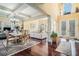 Open-concept living and dining area with hardwood floors and abundant natural light at 6016 Southland Dr, Stone Mountain, GA 30087