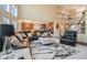 Spacious living room with a fireplace, high ceilings, and a view to the kitchen at 6016 Southland Dr, Stone Mountain, GA 30087