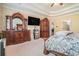 The bedroom features a large dresser and a TV, creating a comfortable and functional space at 6016 Southland Dr, Stone Mountain, GA 30087