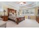 Spacious bedroom with trey ceilings, large windows, and carpet floors creating a peaceful retreat at 6016 Southland Dr, Stone Mountain, GA 30087