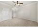 Spacious bedroom with neutral carpet and ceiling fan at 1850 Cotillion Dr # 1008, Atlanta, GA 30338