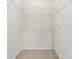 Walk-in closet with shelving and neutral carpet at 1850 Cotillion Dr # 1008, Atlanta, GA 30338