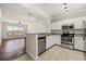 Bright kitchen featuring white cabinets, stainless steel appliances, granite countertops, and tile floor at 1850 Cotillion Dr # 1008, Atlanta, GA 30338