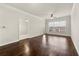 Bright living room with wood floors, ceiling fan, and access to the outdoors through a glass door at 1850 Cotillion Dr # 1008, Atlanta, GA 30338