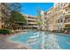 Large in-ground pool with seating and pergola at 1850 Cotillion Dr # 1008, Atlanta, GA 30338