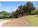 Community sign nestled among trees and landscaping at 1850 Cotillion Dr # 1008, Atlanta, GA 30338