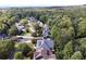 Neighborhood aerial view displays well-maintained homes and lush greenery, offering a peaceful, suburban setting at 216 Crescent Moon Way, Canton, GA 30114