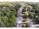 Aerial view of a tranquil neighborhood showcases the well-spaced homes surrounded by mature trees and landscaped yards at 216 Crescent Moon Way, Canton, GA 30114