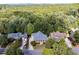 An aerial shot showcasing the house with a lush, green landscape, beautiful neighborhood, and mountain views at 216 Crescent Moon Way, Canton, GA 30114