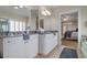 Elegant bathroom boasts a dual sink vanity and a glimpse into the main bedroom at 216 Crescent Moon Way, Canton, GA 30114