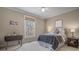 Comfortable bedroom with large window; offers a serene and relaxing atmosphere at 216 Crescent Moon Way, Canton, GA 30114