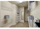 Spacious walk-in closet featuring custom shelving for optimal organization at 216 Crescent Moon Way, Canton, GA 30114