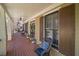 Charming front porch with wicker furniture, shuttered windows, and a welcoming entryway at 216 Crescent Moon Way, Canton, GA 30114