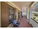 Inviting front porch with wicker furniture, shutters and a view of the front yard at 216 Crescent Moon Way, Canton, GA 30114