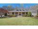 Inviting single-Gathering home with a covered porch and a beautifully landscaped front yard at 216 Crescent Moon Way, Canton, GA 30114