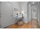 Charming hallway with hardwood floors and a built-in desk area; extra storage at 216 Crescent Moon Way, Canton, GA 30114