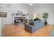 Bright living room boasts hardwood floors, stone fireplace, and an open, airy design at 216 Crescent Moon Way, Canton, GA 30114