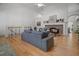 Comfortable living room showcases hardwood floors, stone fireplace, and an open layout at 216 Crescent Moon Way, Canton, GA 30114