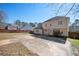 The home has a spacious backyard and a large concrete patio at 3090 Perch Overlook Sw, Marietta, GA 30008