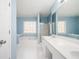 Bright bathroom featuring double vanity, soaking tub, and separate glass-enclosed shower at 3090 Perch Overlook Sw, Marietta, GA 30008