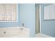 Close up of a soaking tub next to glass enclosed shower at 3090 Perch Overlook Sw, Marietta, GA 30008