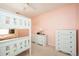 Pink bedroom with white bunk bed and two dressers at 3090 Perch Overlook Sw, Marietta, GA 30008