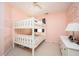 Pink bedroom featuring a white bunk bed and dresser at 3090 Perch Overlook Sw, Marietta, GA 30008