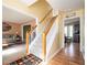 Inviting entryway with wood floors and a staircase leading to the upper level at 3090 Perch Overlook Sw, Marietta, GA 30008