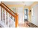 Bright entryway with hardwood floors, stairway, and access to other rooms at 3090 Perch Overlook Sw, Marietta, GA 30008