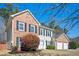 Charming two-story brick and siding home with a well-manicured lawn and attached two-car garage at 3090 Perch Overlook Sw, Marietta, GA 30008
