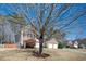 Charming two-story brick and siding home with a well-manicured lawn and attached two-car garage at 3090 Perch Overlook Sw, Marietta, GA 30008