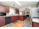 Modern kitchen with stainless steel appliances and granite countertops open to the living room at 3090 Perch Overlook Sw, Marietta, GA 30008