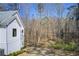 Landscaped backyard with a wooden fence and lush foliage at 555 Lower Birmingham Rd, Canton, GA 30115