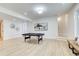 Large basement area with a pool table, light wood floors, and minimal decorations at 555 Lower Birmingham Rd, Canton, GA 30115