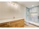 Modern bathroom featuring light-colored wood cabinets, quartz countertop, and stunning walk-in shower at 555 Lower Birmingham Rd, Canton, GA 30115