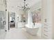 Modern bathroom with a free-standing tub, vanity and a large window with a wooded view at 555 Lower Birmingham Rd, Canton, GA 30115