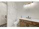 Bathroom featuring elegant marble tiling in the walk-in shower, with modern vanity at 555 Lower Birmingham Rd, Canton, GA 30115
