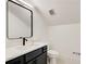Modern bathroom featuring dark vanity, black hardware and a vessel sink with quartz countertop at 555 Lower Birmingham Rd, Canton, GA 30115