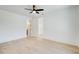 Bright bedroom with ceiling fan, wooden floors, and an ensuite bathroom and walk-in closet at 555 Lower Birmingham Rd, Canton, GA 30115