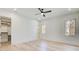 Bright bedroom featuring a ceiling fan, windows and an attached walk in closet at 555 Lower Birmingham Rd, Canton, GA 30115