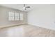 Well-lit bedroom features neutral walls, light wood floors, and large windows at 555 Lower Birmingham Rd, Canton, GA 30115
