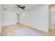 Bedroom with wood floors, ceiling fan, and passage to other rooms in the home at 555 Lower Birmingham Rd, Canton, GA 30115